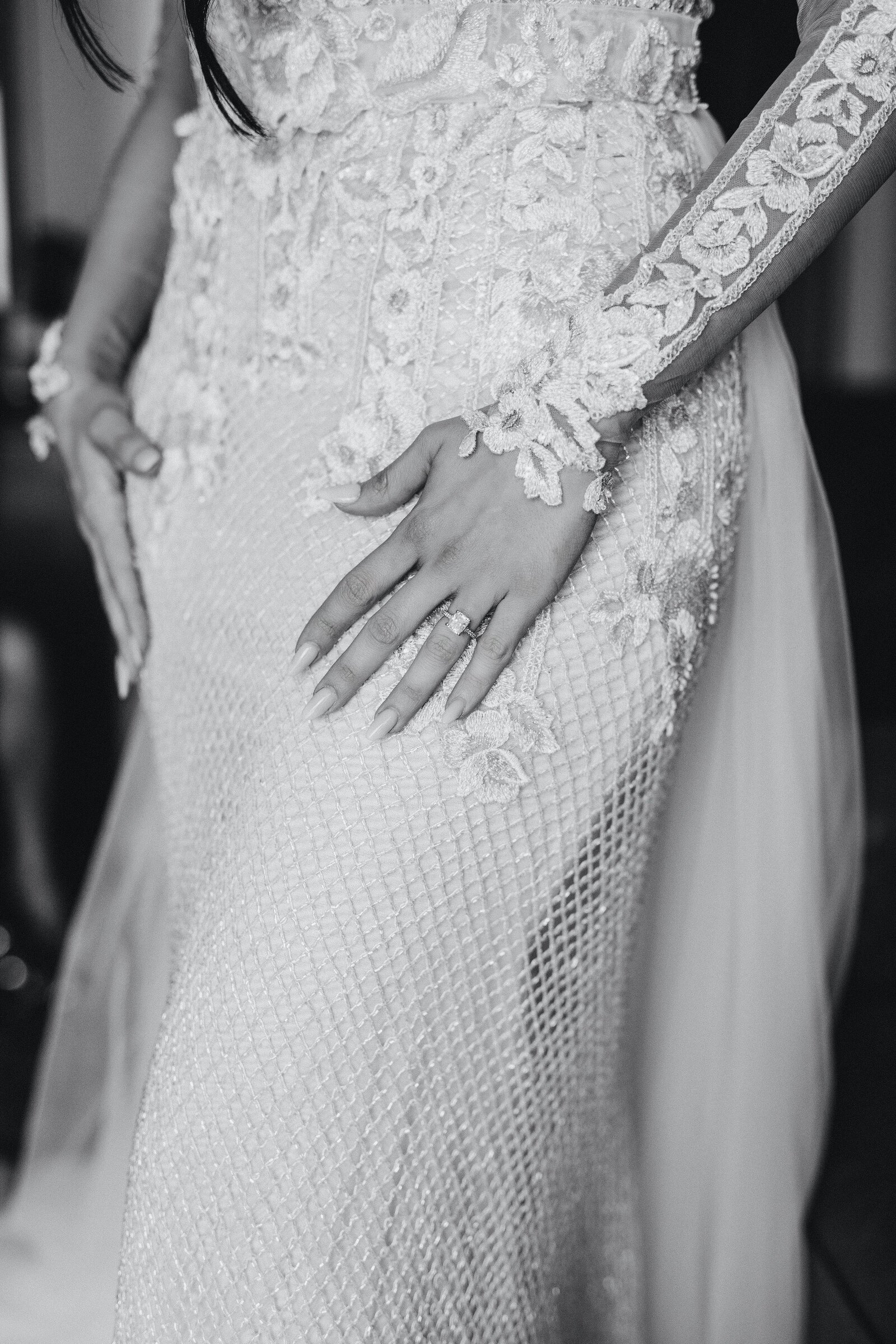 details of a bride's wedding gown while working with a dallas wedding planner