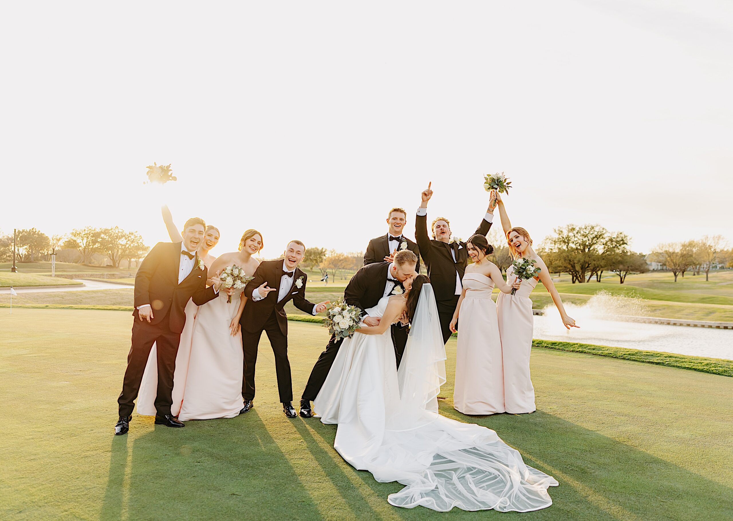 Bridal party laughing and smiling photos taken at sunset after the Wedding at Stonebriar Country Club located in Frisco, Texas.